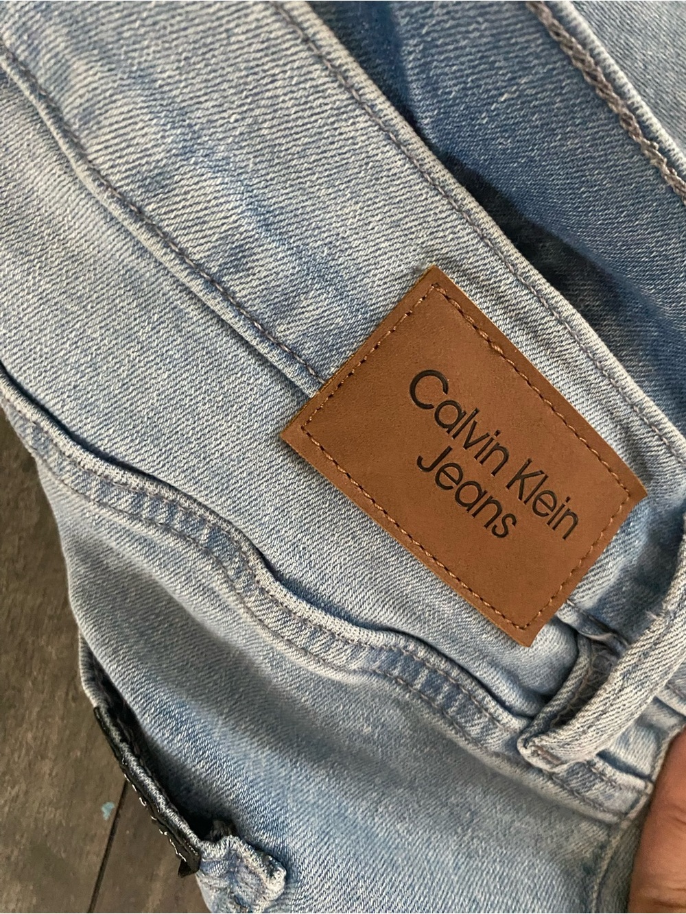 Calvin Klein Jeans Light Blue Denim with Brown Patch
